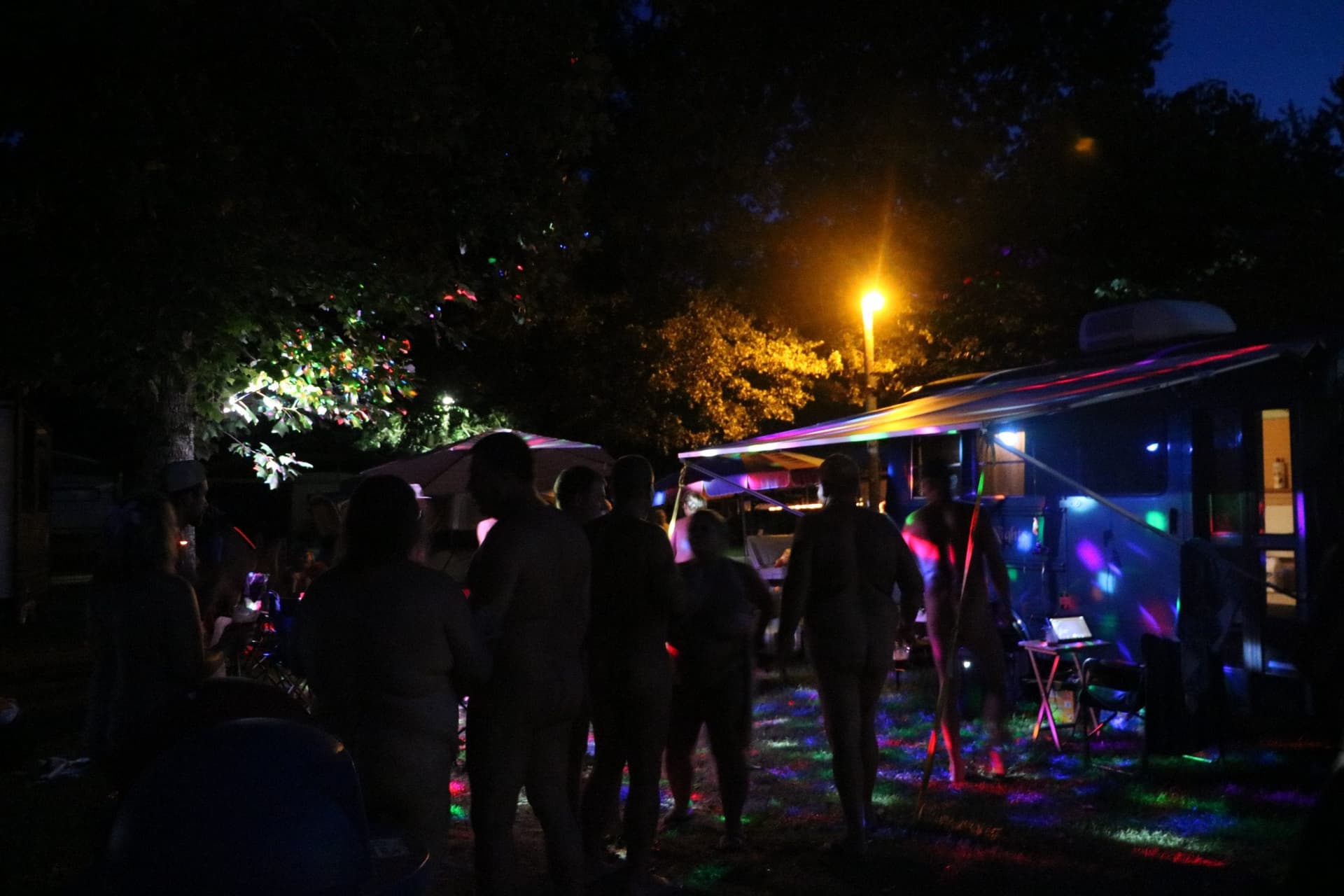 Evening party with colorful lights at the campground