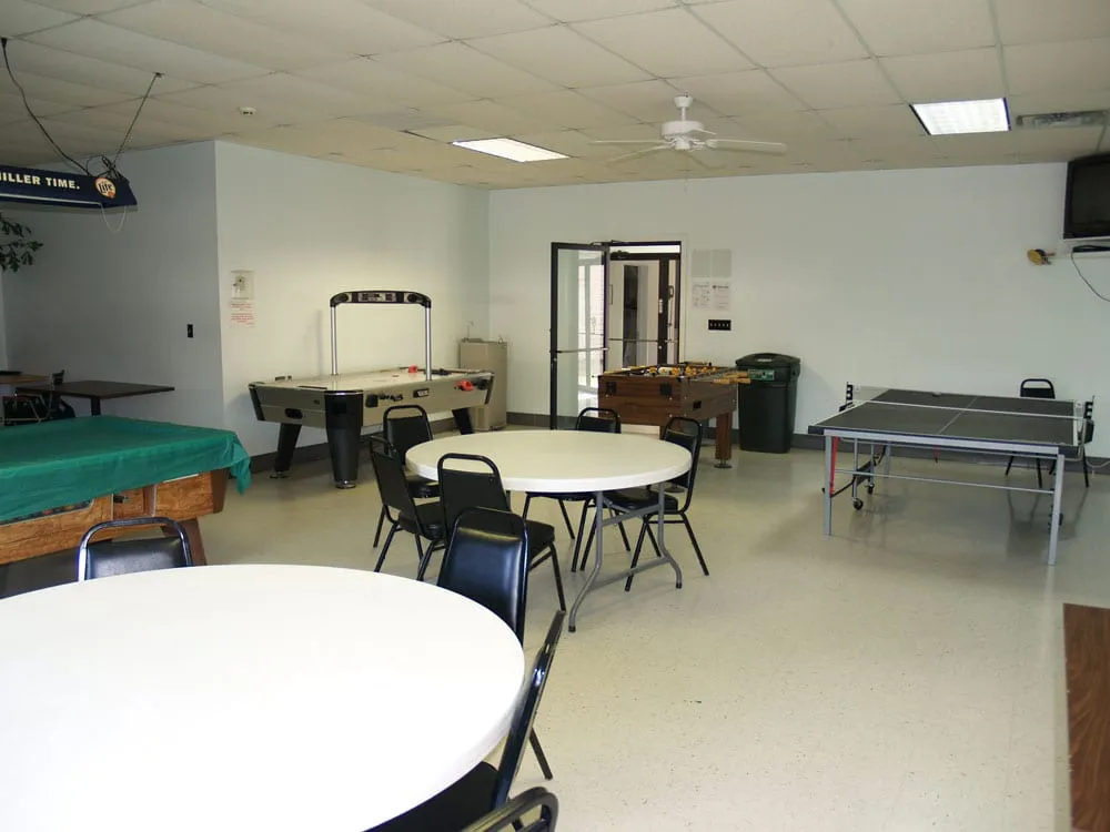 Game room with pool table, arcade games, and classic entertainment